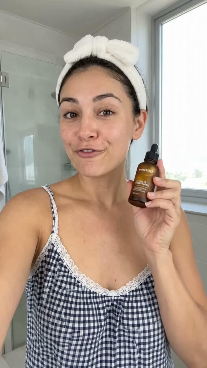 A Hazevio presenter ad for Verdant Lab, an invented demo brand: an AI-generated presenter in a bright bathroom holding a small amber serum bottle.
